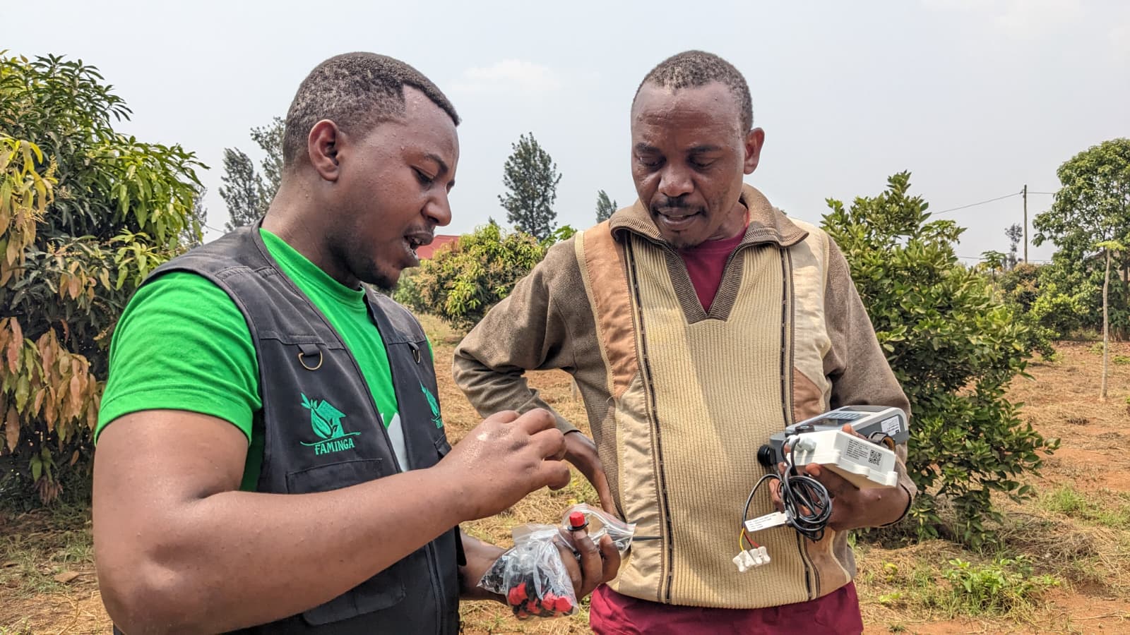 Faminga team training farmers on soil sensors